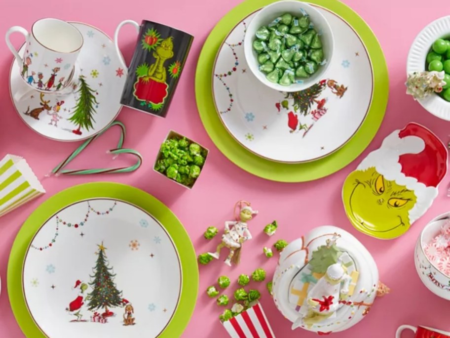 Grinch plates, bowls, mugs, and platters on a table