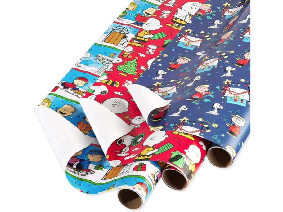 three rolls of peanuts christmas wrapping paper