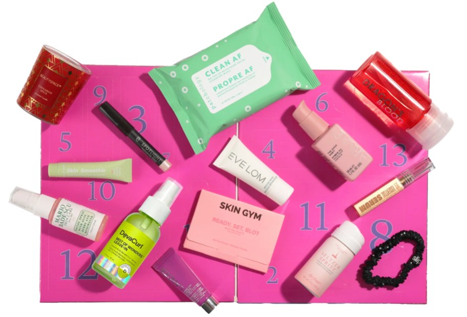 beauty products on top of a pink advent calendar box