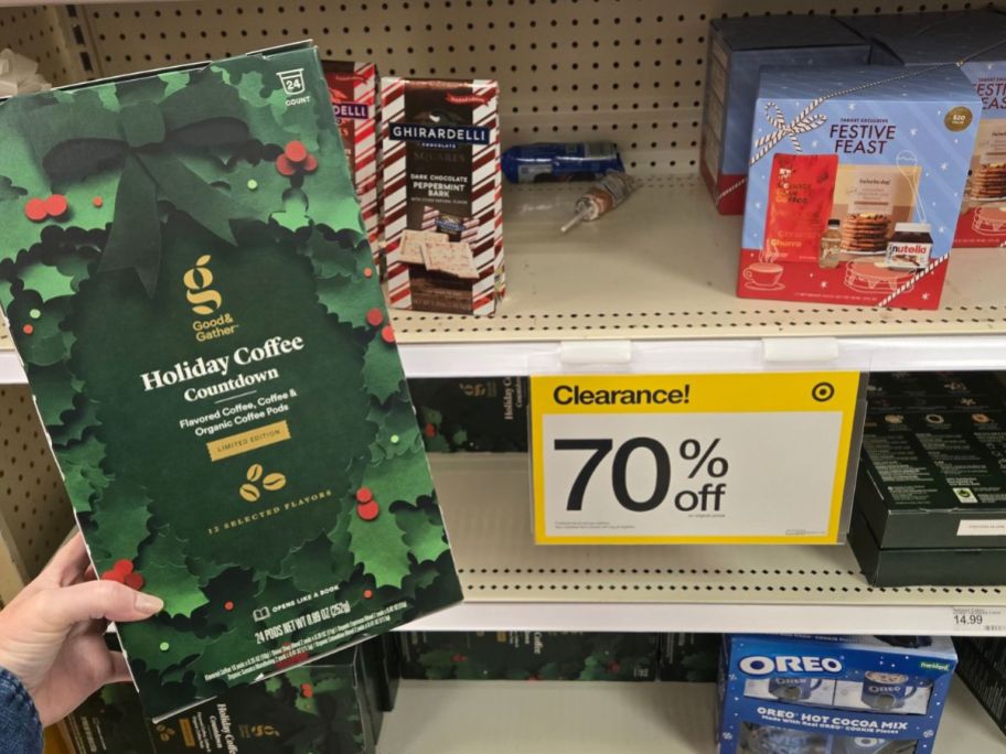 womans hand holding a coffee advent calendar