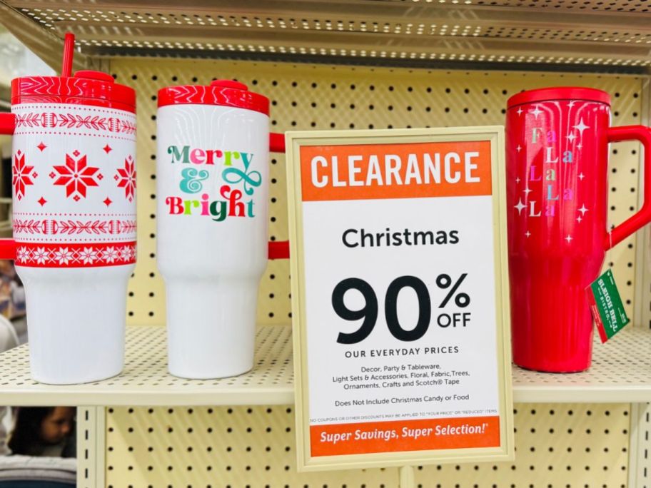 3 Holiday Design Reusable Beverage Tumblers on the shelf at Hobby Lobby