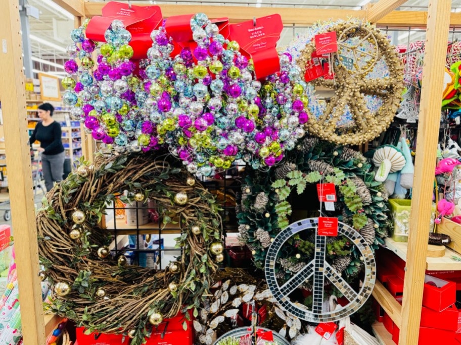 Holiday wreaths displayed on a wall