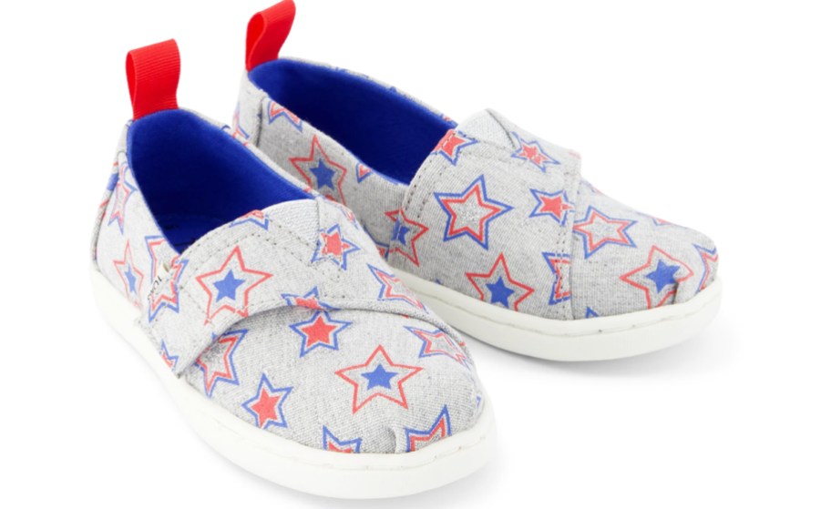 pair of grey slip on shoes with red and blue stars