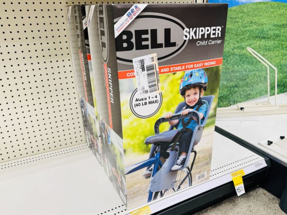 a bike seat for a toddler on a store shelf