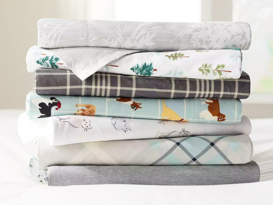 stack of folded sheets in various colors and prints