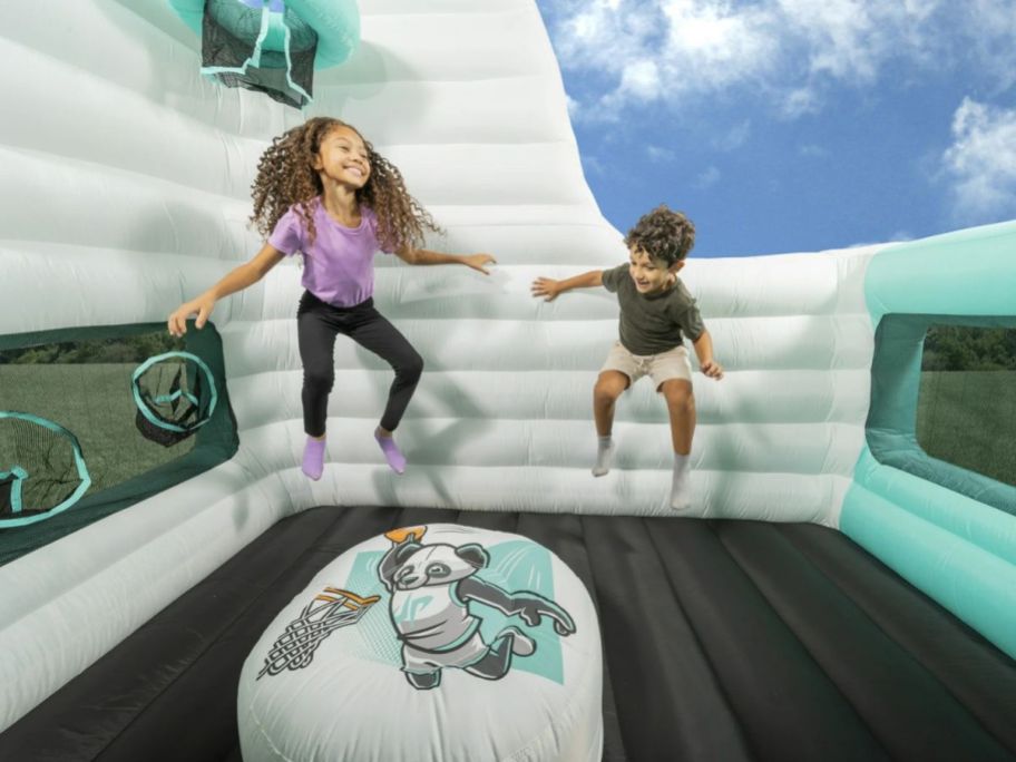 Kids jumping inside a bounce house