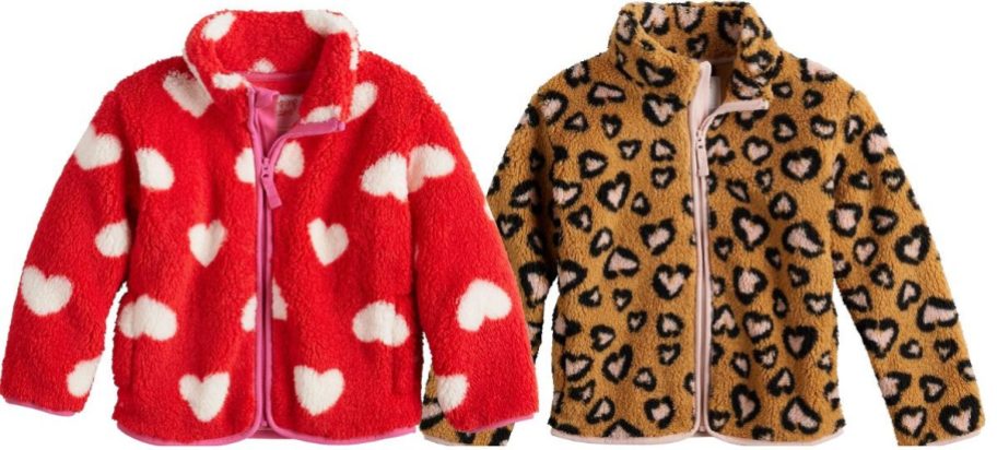 two baby girls printed fleece jackets stock images