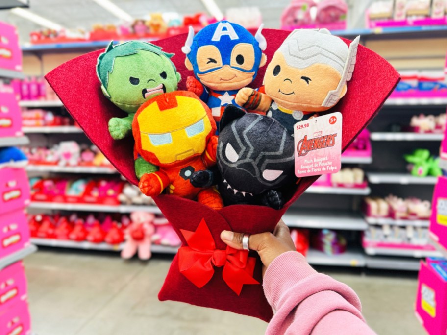 hand holding up Marvel Avengers 16" Plush Valentine's Bouquet in store