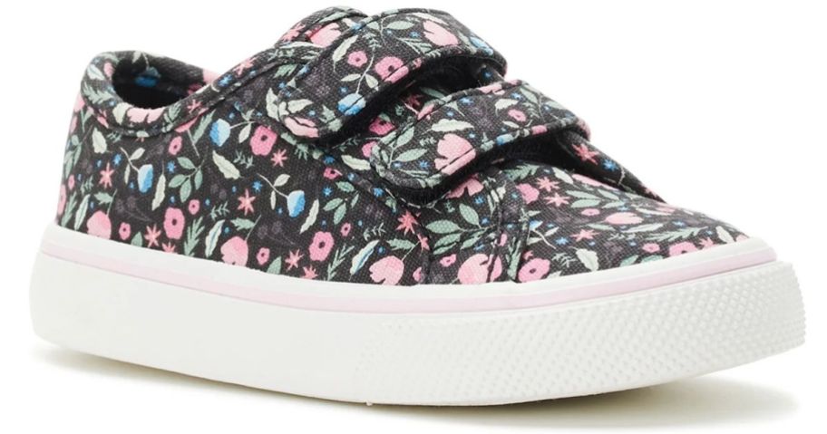 A velcro sneaker with flowers on it