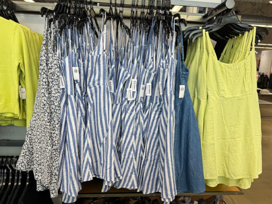 blue and white striped and lime green womens dresses hanging in old navy store