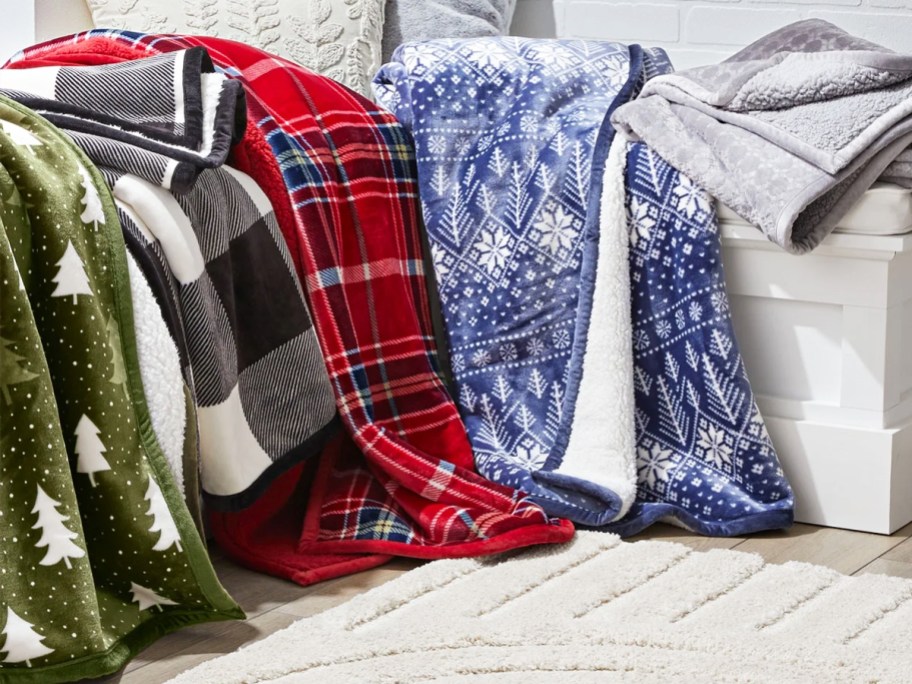 multiple throw blankets draped over a couch