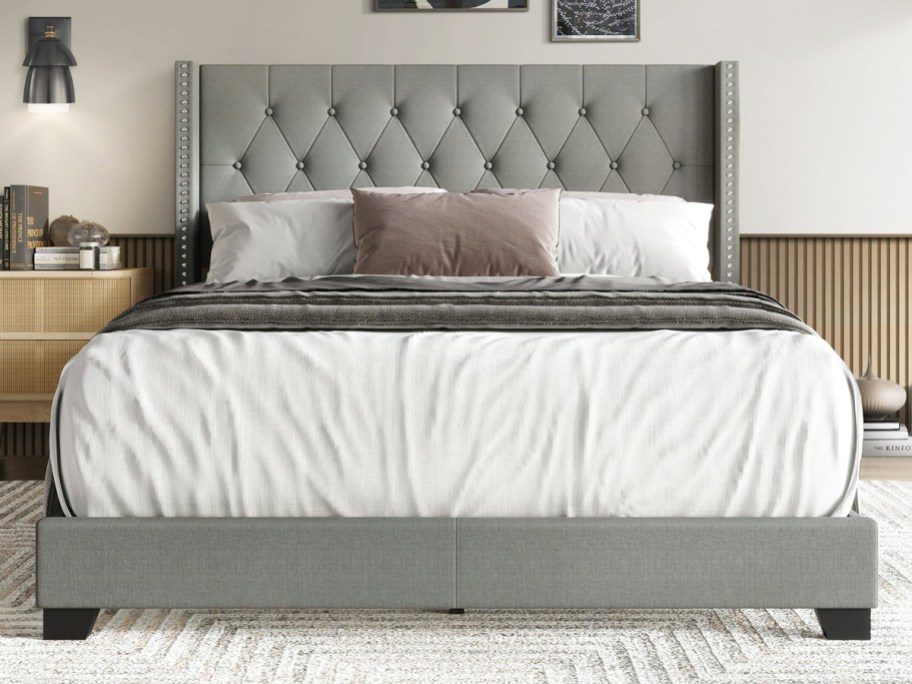 grey upholstered headboard with bed frame