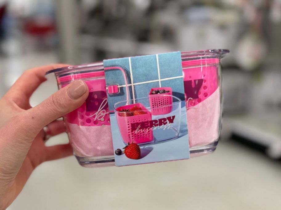 hand holding a Tabitha Brown Berry Storage Container