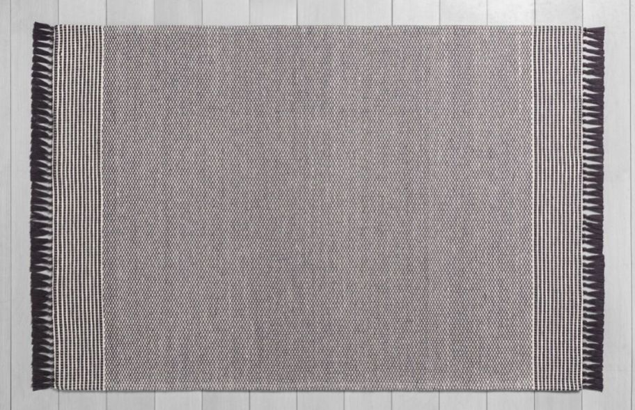 a gray textured area rug